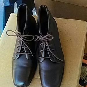 Brown lace up ankle booties.